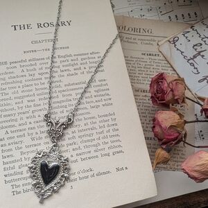 Silvertone Sacred Heart Pendant Necklace with Black Stone